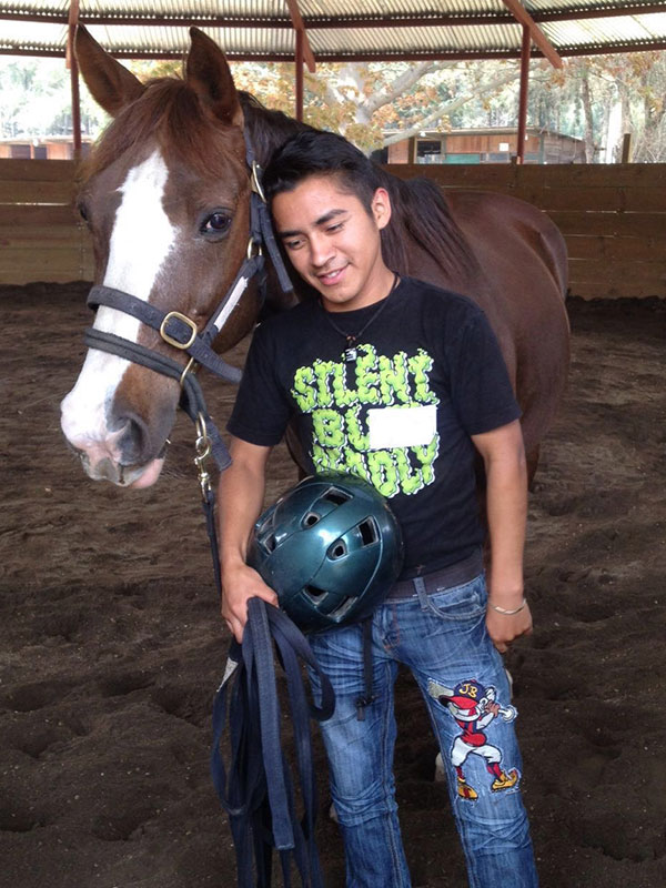 Guatemalan teen with a horse at Lead-Up Guatemala program