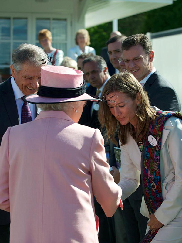 Lead-Up International founder Katie Cunningham Pokorny receives an award from the Queen of England