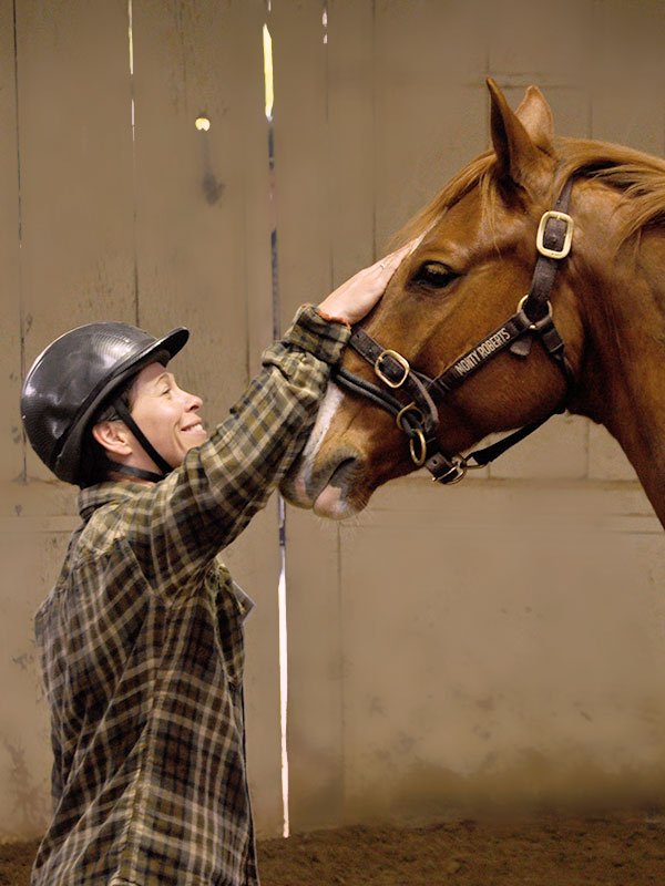 Moment of Join-Up between veteran and horse wearing Dually halter